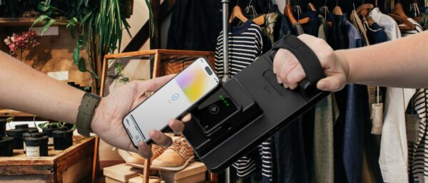 Mobile Point of Sale mPOS card reader used with tap to pay in retail store